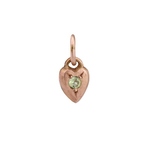 Front-facing view of Mini Heart Charm in 14k rose gold with peridot by Betsy Barron