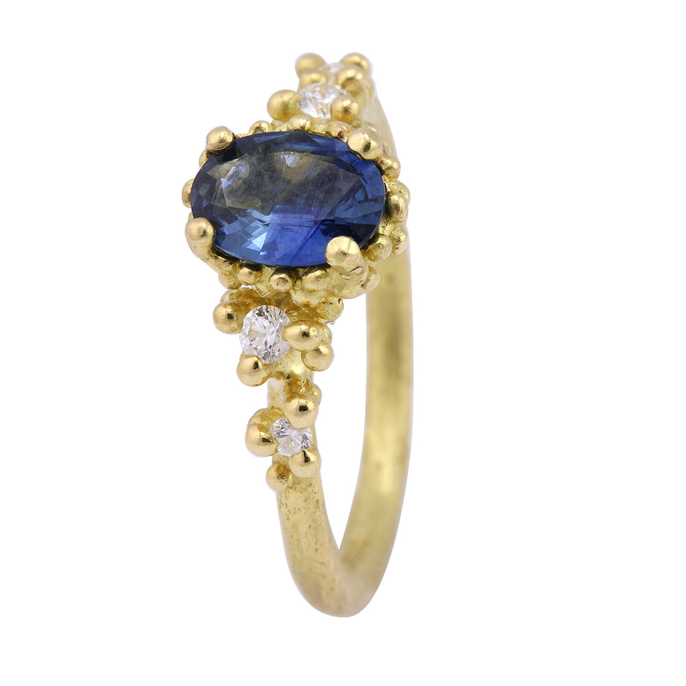 Vertical view of Oval Blue Sapphire Encrusted Ring by Ruth Tomlinson