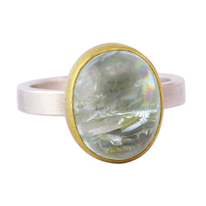 Angled view of Oval Aquamarine Cabochon Ring by Sam Woehrmann.