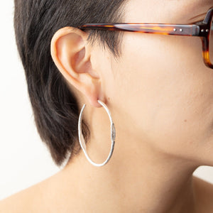 Model wearing Tonia Hoop earrings by Betsy Barron Jewellery on right ear