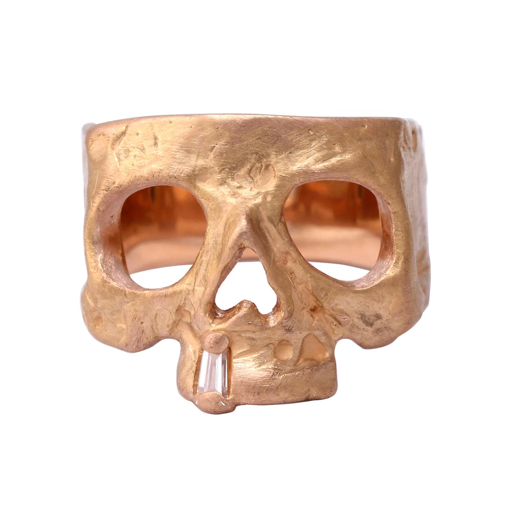 Front view of 18k yellow gold skull ring by Polly Wales.