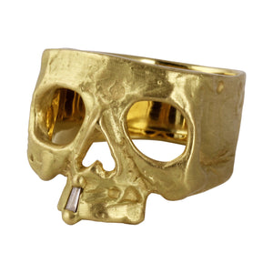 Front angled view of 18k yellow gold Skull Ring with Diamond Snaggletooth by Polly Wales