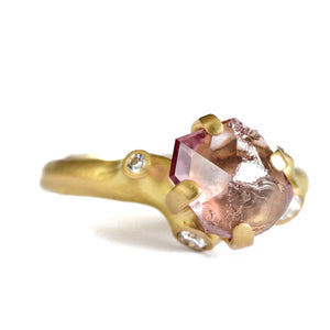 Angled view of Malaya Garnet Rough Luxe Ring by Johnny Ninos