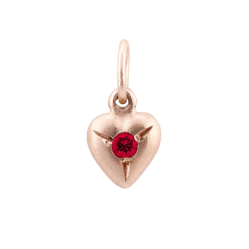 Front-facing view of Puff Heart Charm in 14k rose gold with ruby by Betsy Barron
