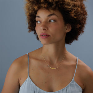 Model wearing Rainbow Crescent Pendant by Sia Taylor