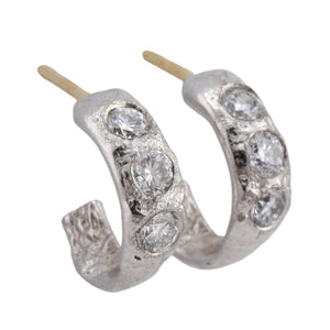 Angled view of Small Molten Hoops in Platinum with white diamonds, by Betsy Barron Jewellery