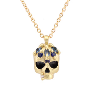 Detail view of Green and Teal Enchanted City Skull Pendant by Polly Wales