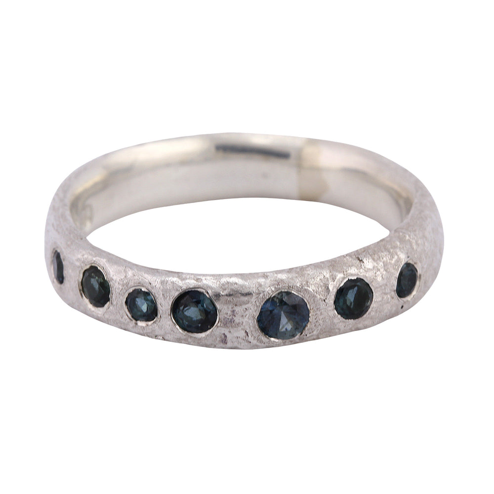 Front-facing view of narrow molten band in Sterling silver w/ 6 Blue Tourmalines and 1 Sapphire, by Betsy Barron Jewellery