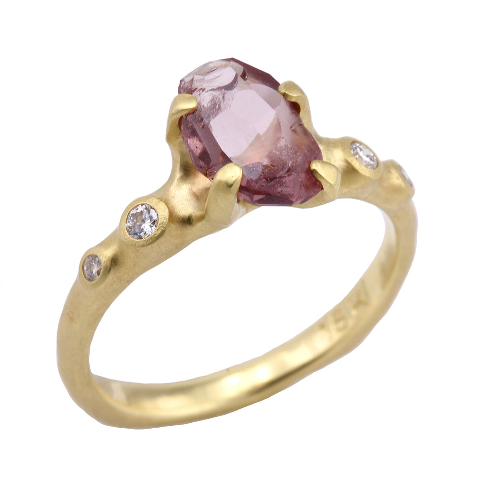 Angled view of Rough Luxe Mahenge Garnet Ring by Johnny Ninos.