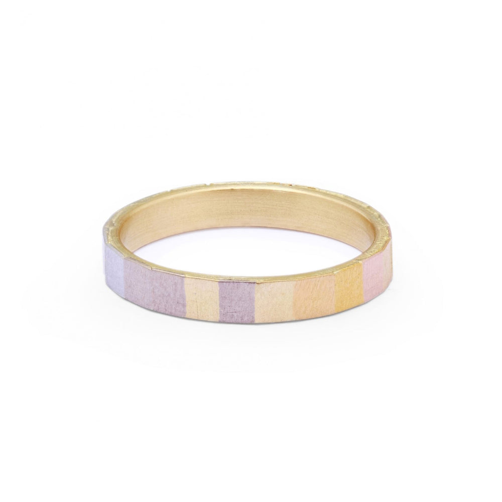 Front-facing view of Wide Rainbow Faceted Band by Sia taylor