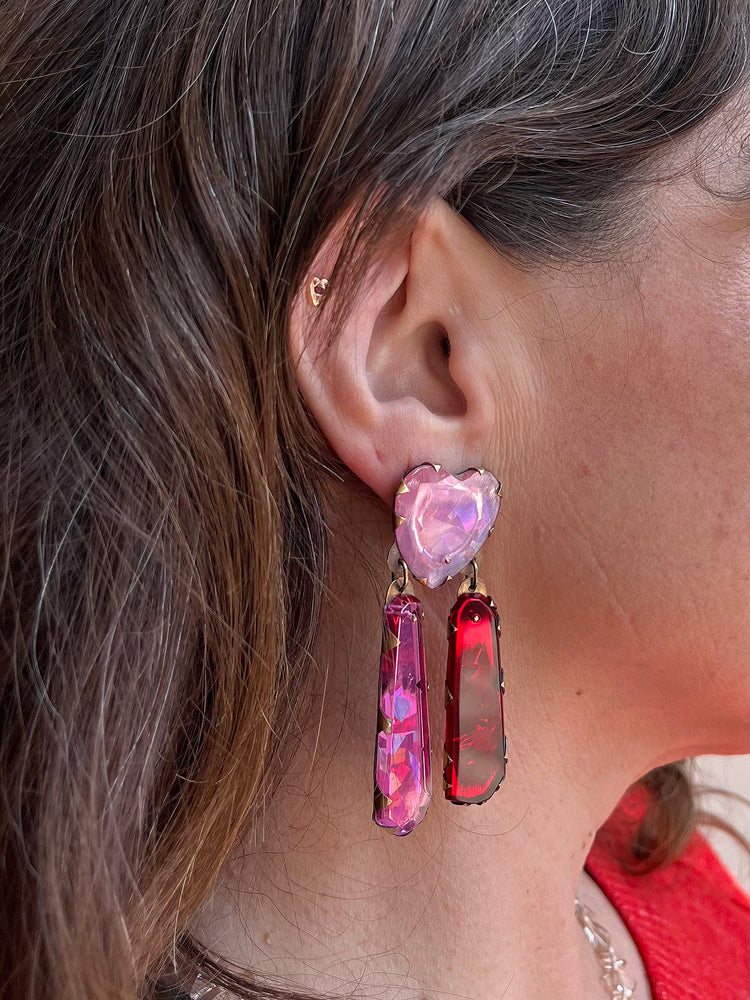 Detail view of model wearing Heart Star Neogem Drop Earrings by Nikki Couppee on right ear.