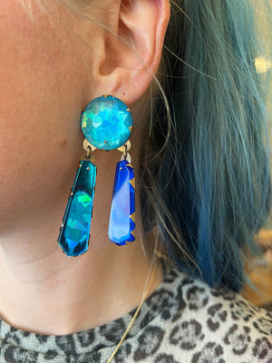 Detail view of model wearing Sapphire Neogem Drop Earring by Nikki Couppee on left ear