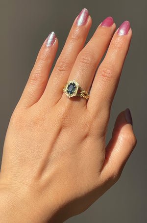 Detail of model wearing  Natural Unheated Madagascar Sapphire and Diamond Ring by The North Way Studio on left hand