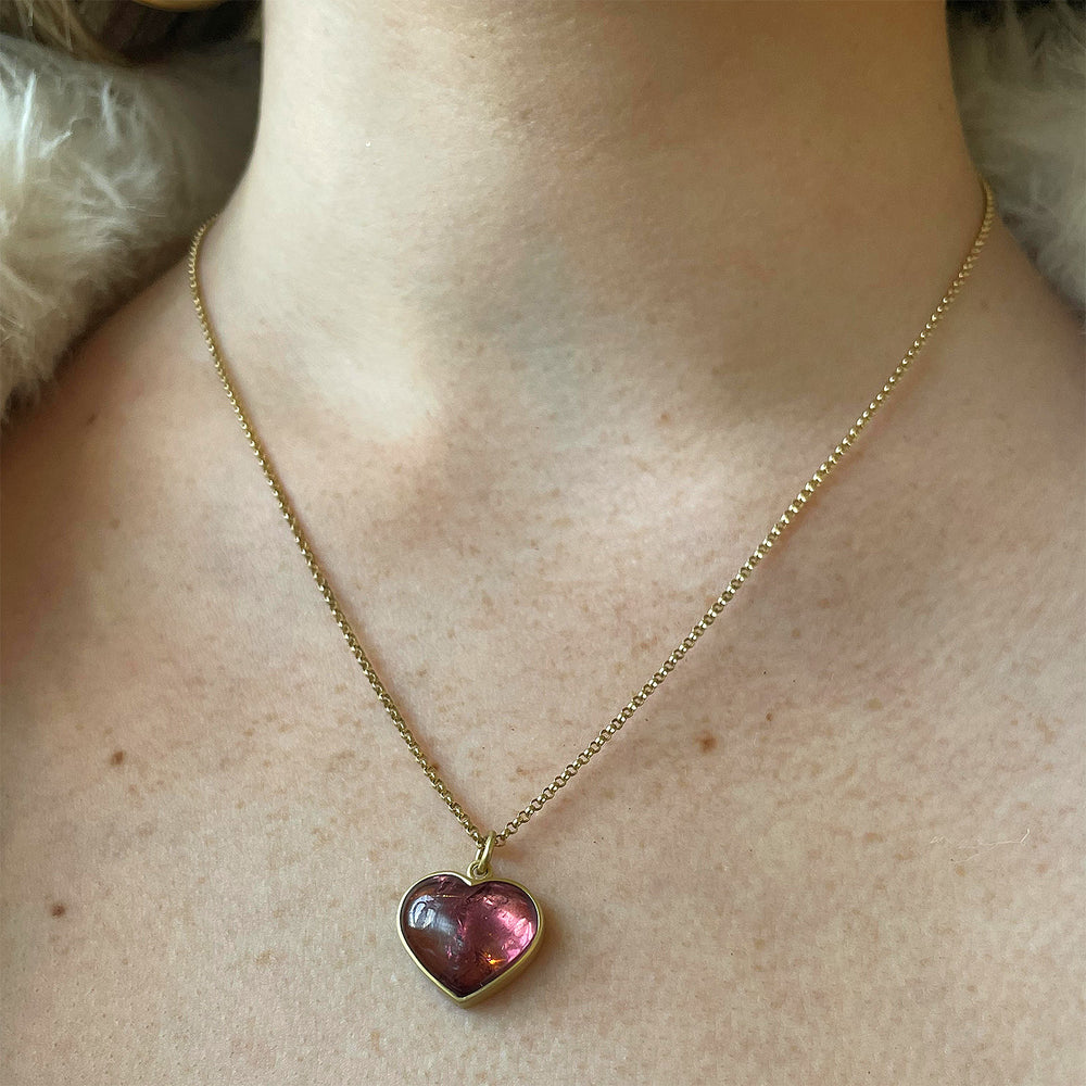 Detail view of model wearing Peachy Pink Tourmaline Sweetheart Necklace by Lola Brooks