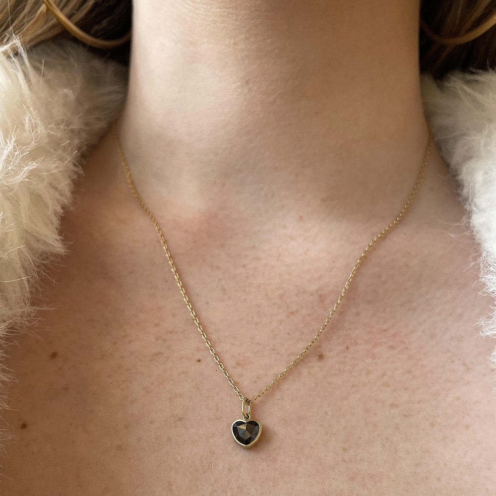 Detail view of model wearing Black Diamond Sweetheart Necklace by Lola Brooks