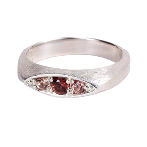 Front-facing view of Remy ring with sterling silver with rose spinel center and pink sapphire side stones by Betsy Barron