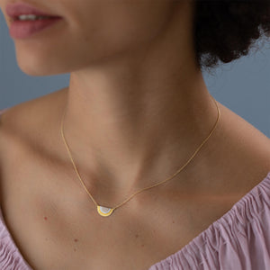 Model Wearing Rainbow Gold Sun Halo Pendant by Sia Taylor