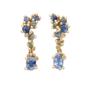 Front-facing view of Asymmetric Sapphire Encrusted Drop Earrings by Ruth Tomlinson