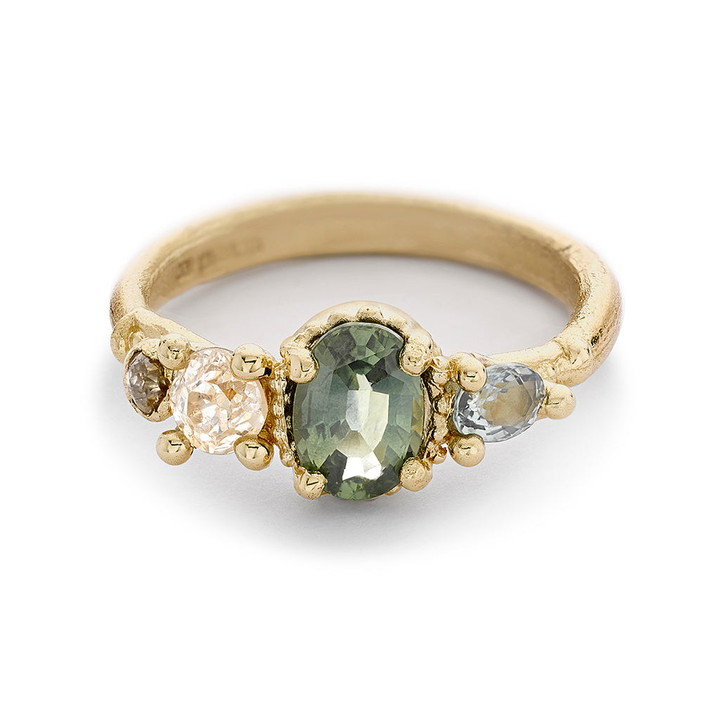 Front-facing view of Green Sapphire and Diamond Four Stone Ring by Ruth Thomlinson