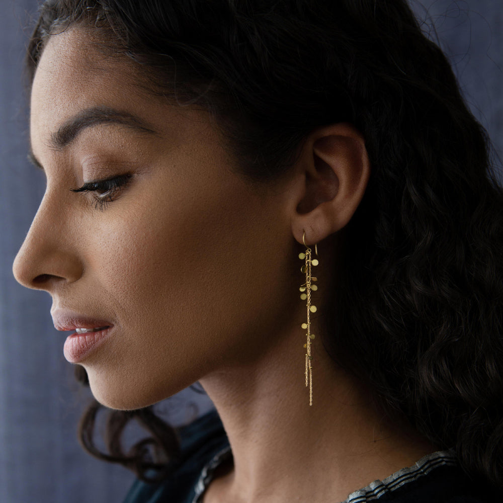 MOdel wearing 18k Random Dots Earrings by Sia Taylor
