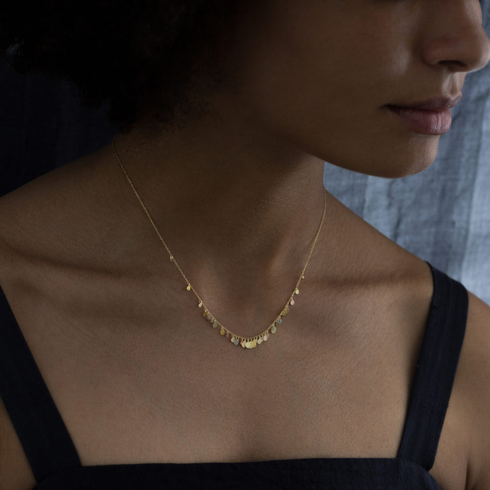 Model wearing Rainbow Birdsong Necklace by Sia Taylor