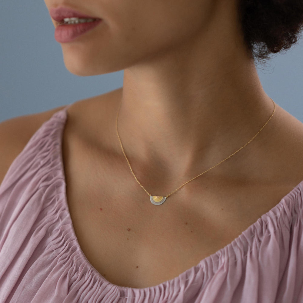 Model wearing Sun Halo Pendant by Sia Taylor