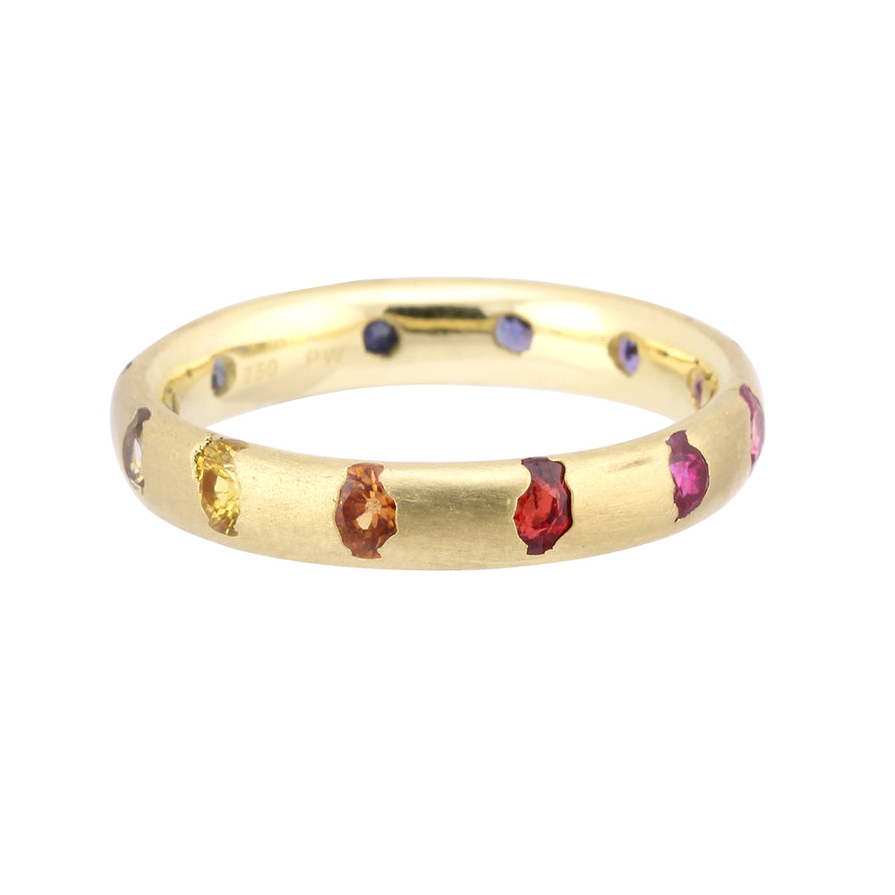 Angled view of narrow Celeste Ring with rainbow sapphires by Polly Wales.