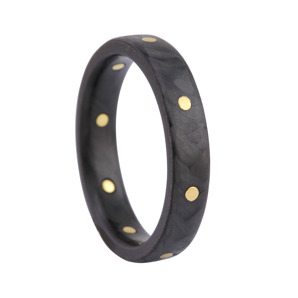 Angled view of Narrow Carbon Fiber Ring with 8 Gold Rivets, size 7.5, by Diana Hall