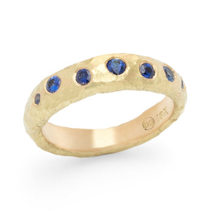 Narrow hammered band by Betsy Barron with seven blue sapphires