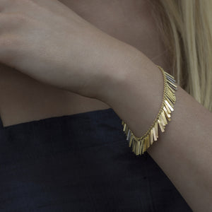 Model wearing Sunset Fringe Bracelet by Sia Taylor on left wrist