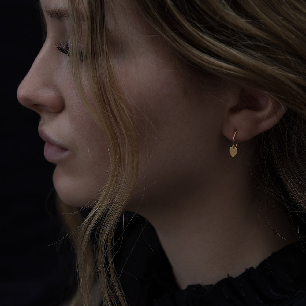 Detail of model wearing Tiny Petal Earring by Sia Taylor