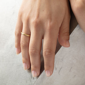 
            
                Load image into Gallery viewer, Lu Band in 18k yellow gold by Betsy Barron, worn on model&amp;#39;s right hand.
            
        
