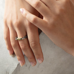 Jason ring in sterling silver with 18ky gold segment by Betsy Barron, worn on model's right hand.