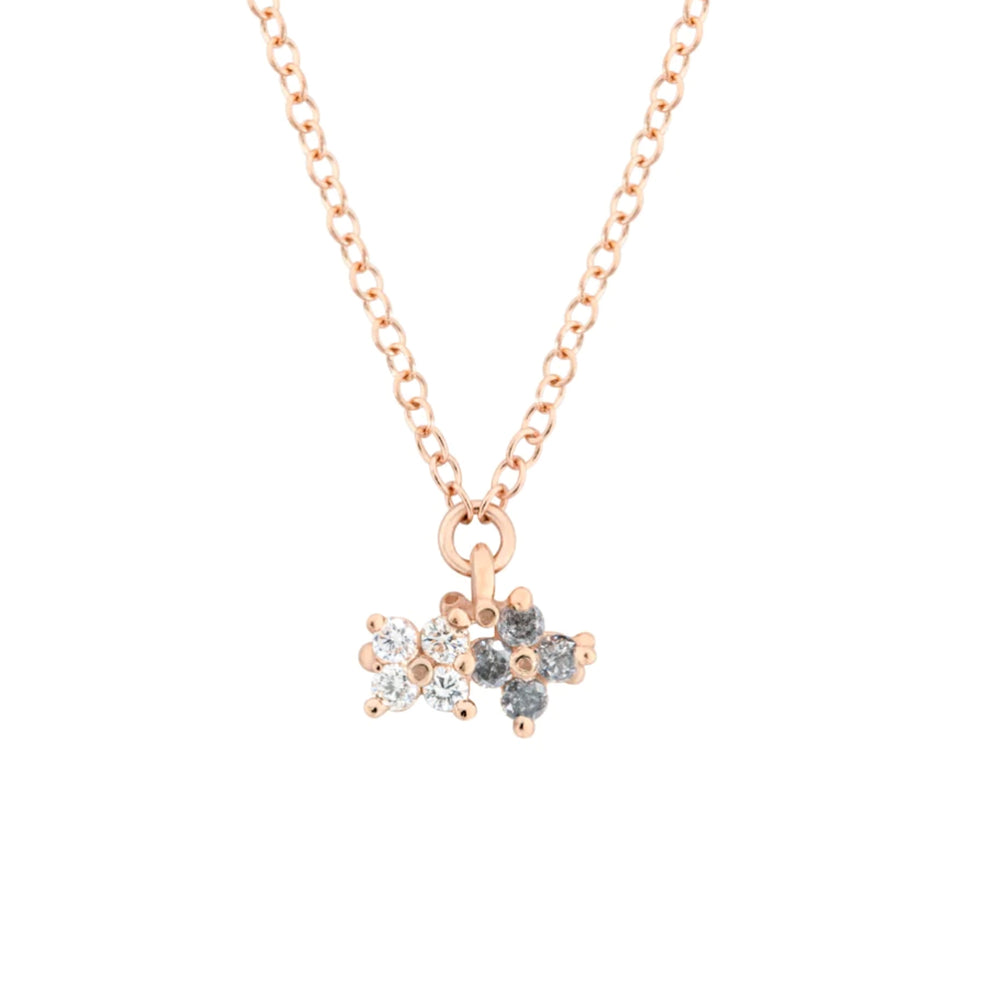 Detail view of Two O'Clover Necklace with white and grey diamonds by Ruta Reifen
