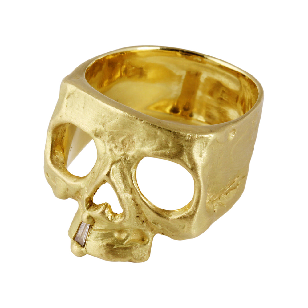 Top angled view of 18k yellow gold Skull Ring with Diamond Snaggletooth by Polly Wales